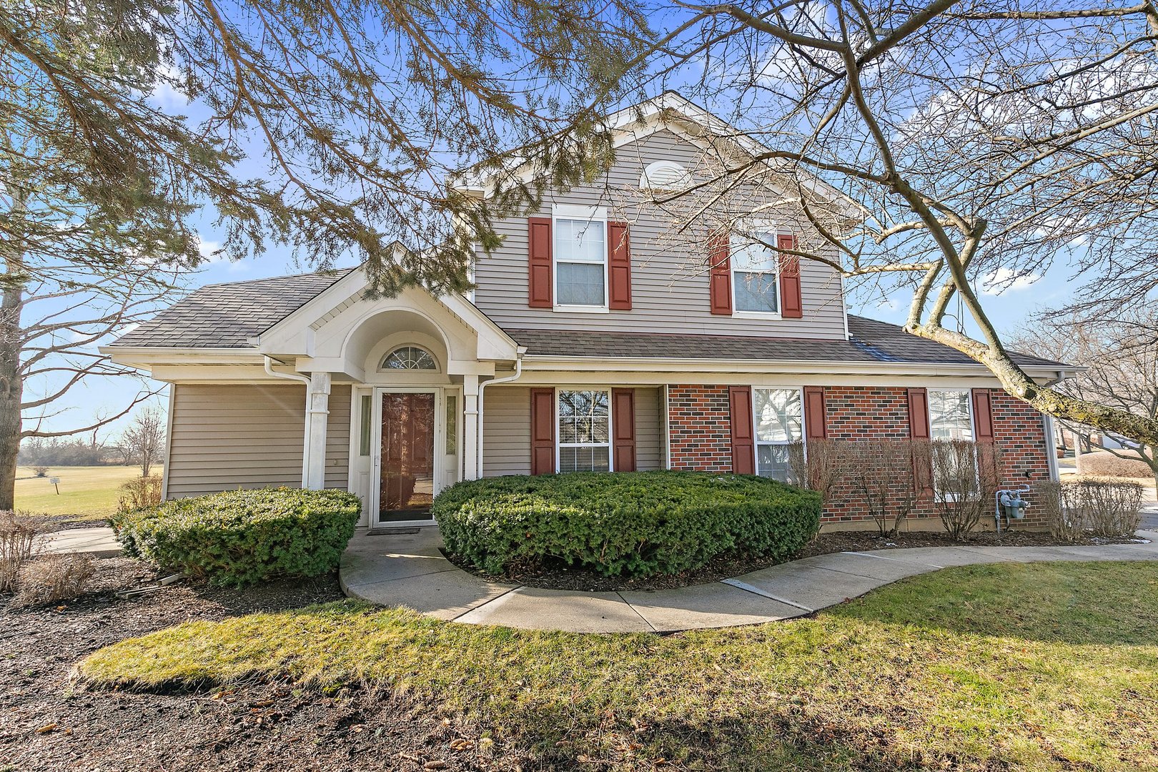 a front view of a house with garden