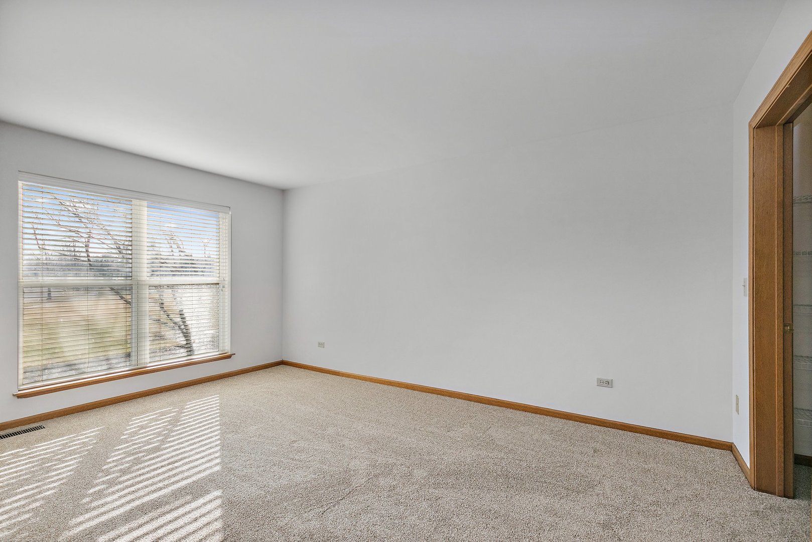2140 Peach Tree Lane Algonquin, IL 60102 - Photo 12 of 16 an empty room with wooden floor and windows