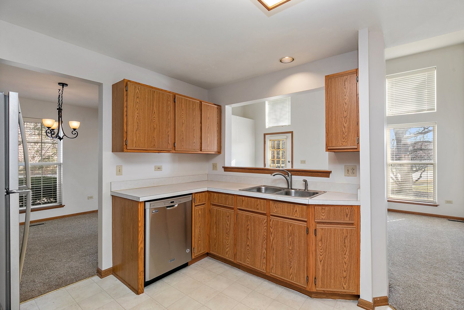 2140 Peach Tree Lane Algonquin, IL 60102 - Photo 9 of 16 a kitchen with a sink stove and cabinets