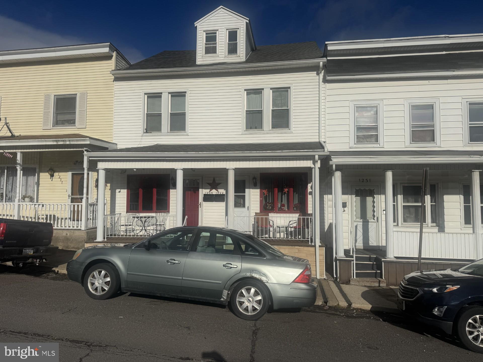 a car parked in front of a house