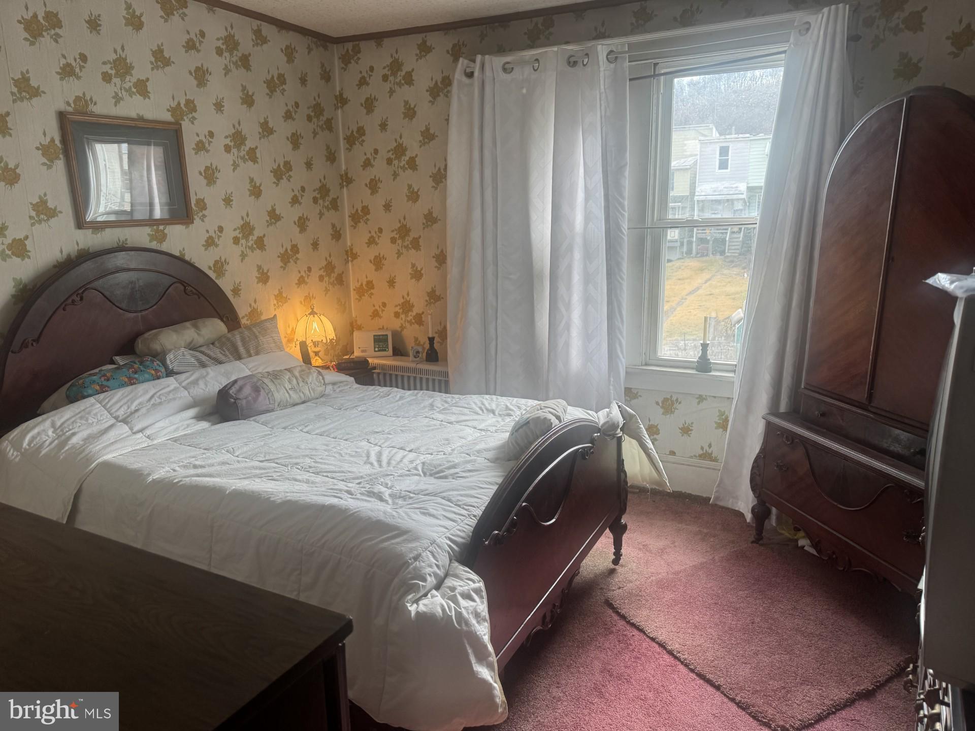 1233 Walnut Street Ashland, PA 17921 - Photo 12 of 30 a bedroom with a bed and a window