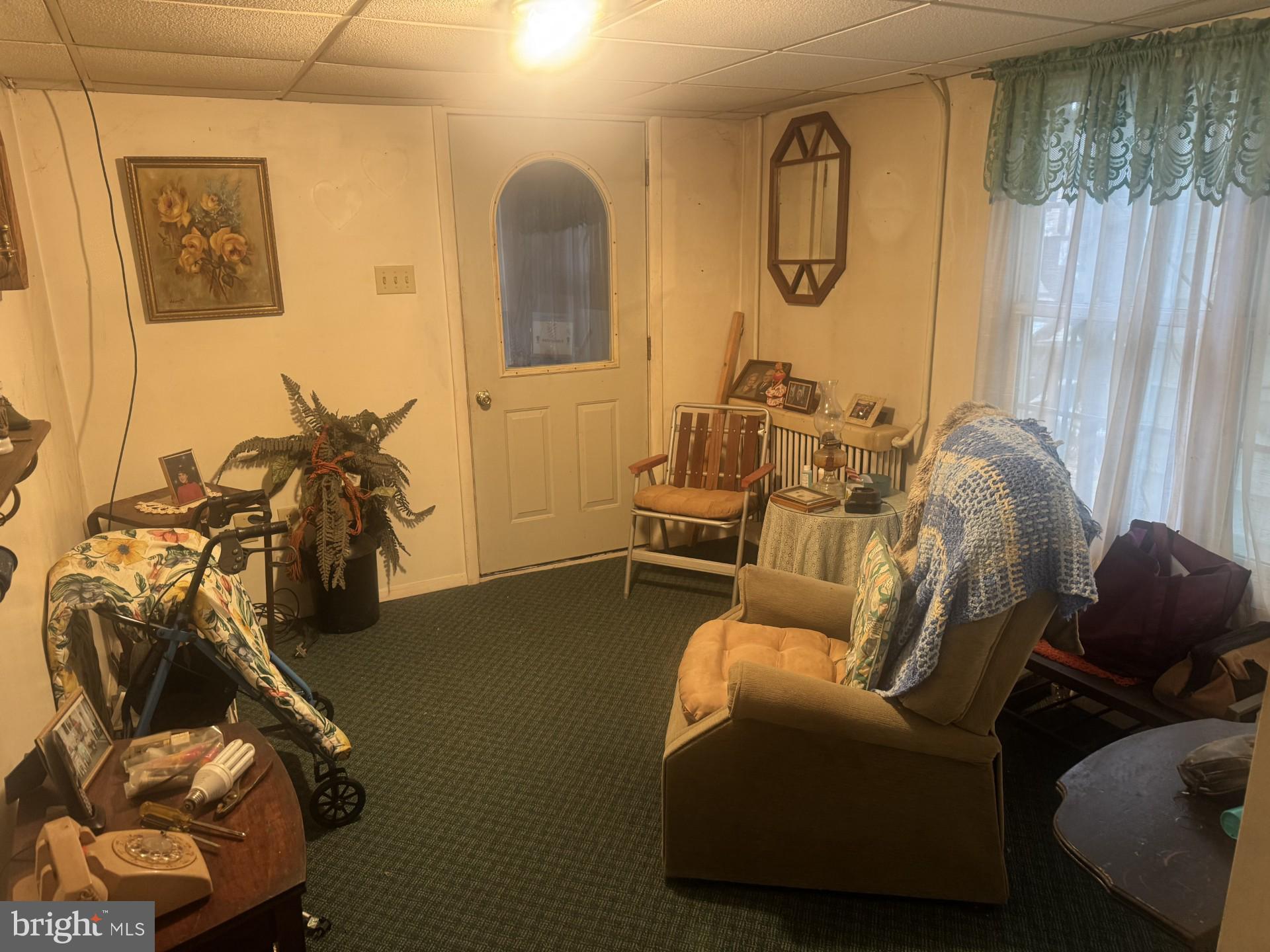 1233 Walnut Street Ashland, PA 17921 - Photo 20 of 30 a living room with furniture a window and gym equipment