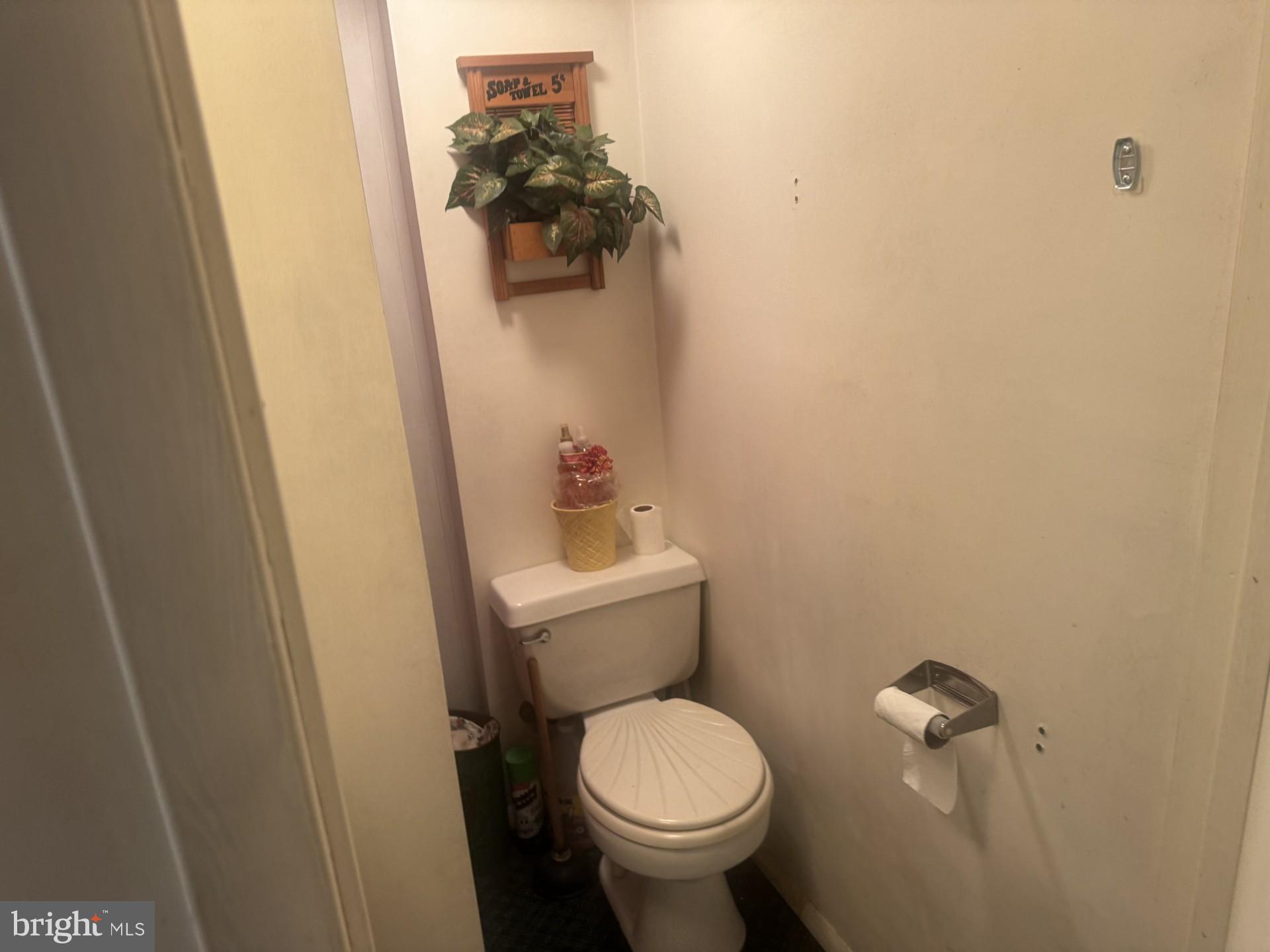 1233 Walnut Street Ashland, PA 17921 - Photo 21 of 30 a white toilet sitting next to a sink