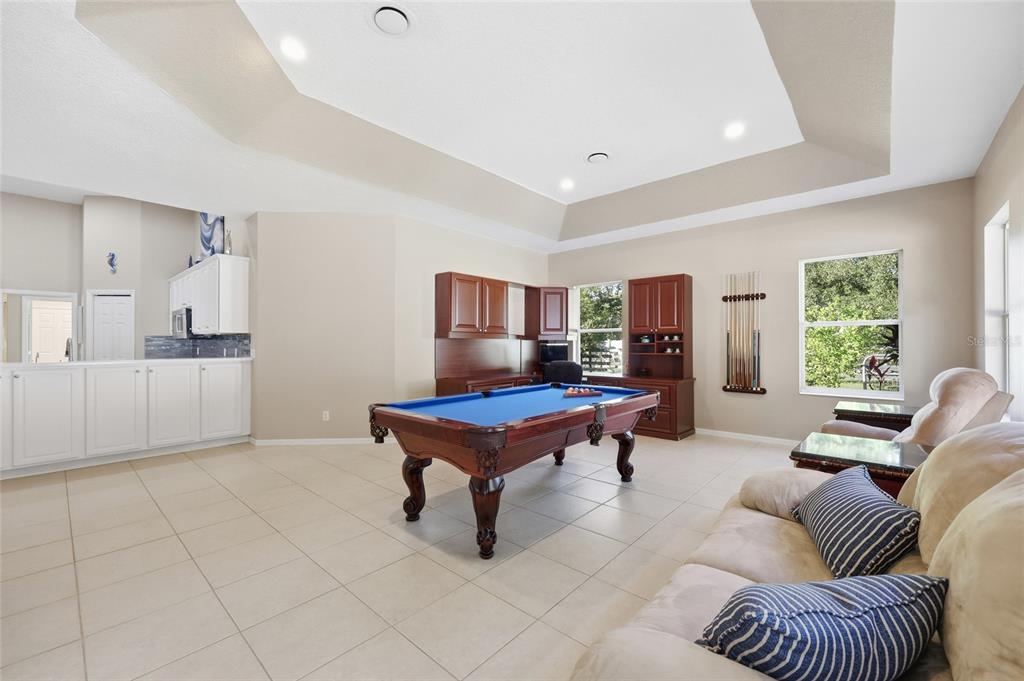 4060 South Kenvera Loop Inverness, FL 34450 - Photo 18 of 50 a living room with furniture a rug and a large window