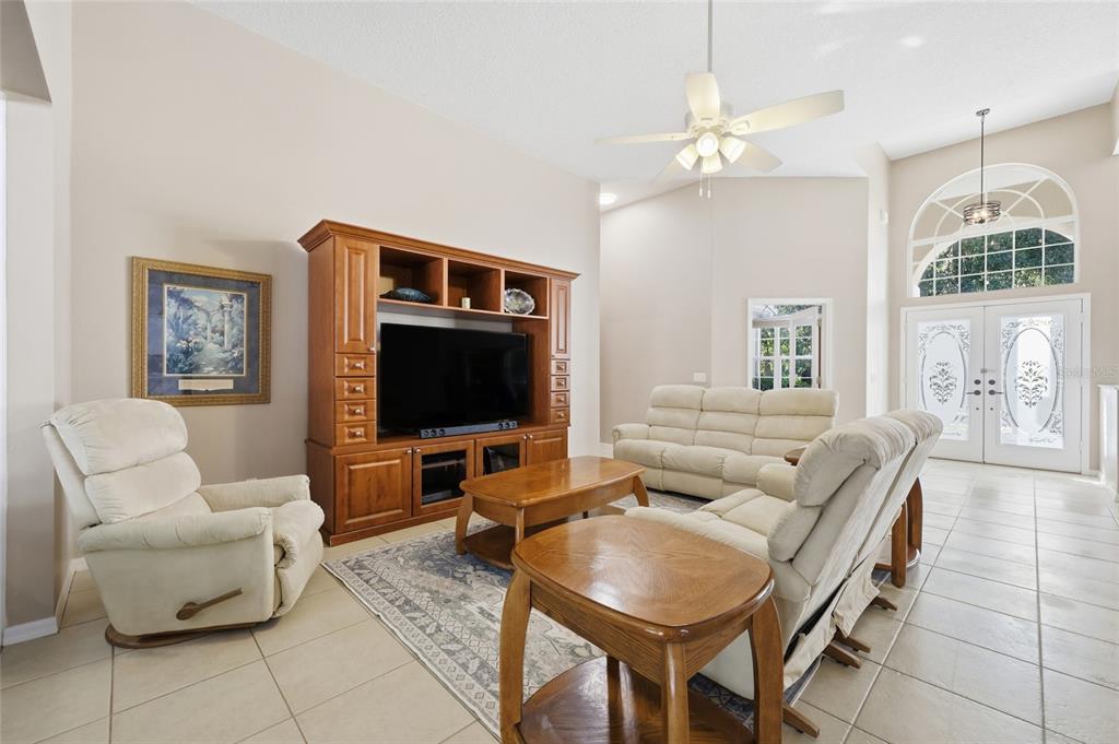 4060 South Kenvera Loop Inverness, FL 34450 - Photo 20 of 50 a living room with furniture a flat screen tv and a window