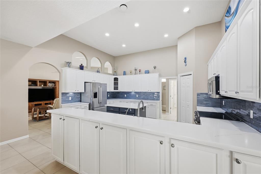 4060 South Kenvera Loop Inverness, FL 34450 - Photo 28 of 50 a kitchen with counter top space cabinets and stainless steel appliances