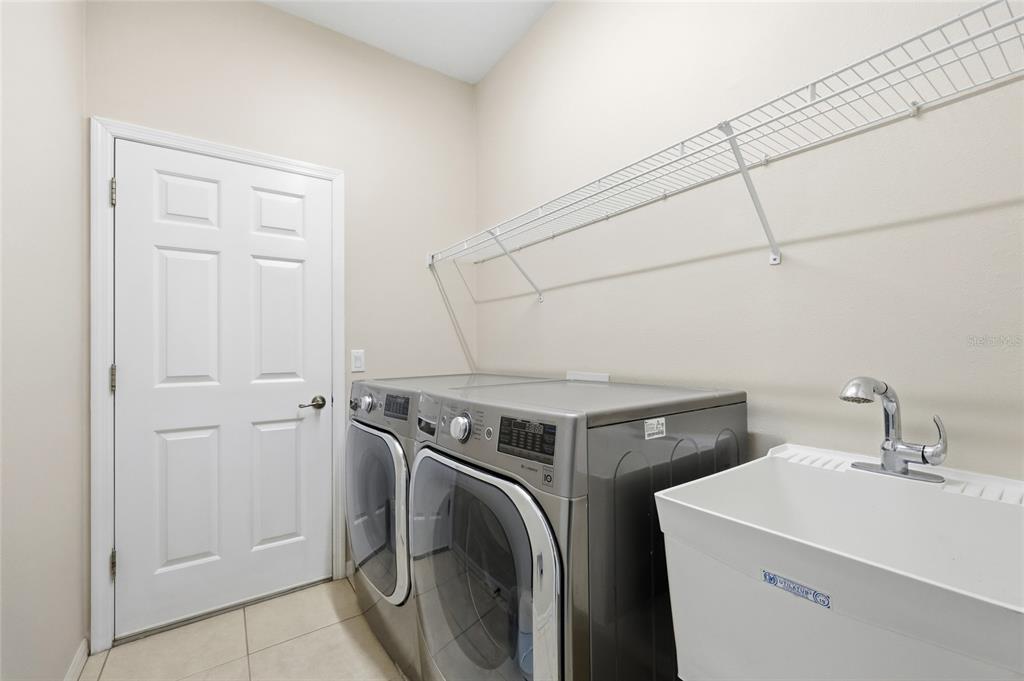 4060 South Kenvera Loop Inverness, FL 34450 - Photo 32 of 50 a utility room with dryer and washer