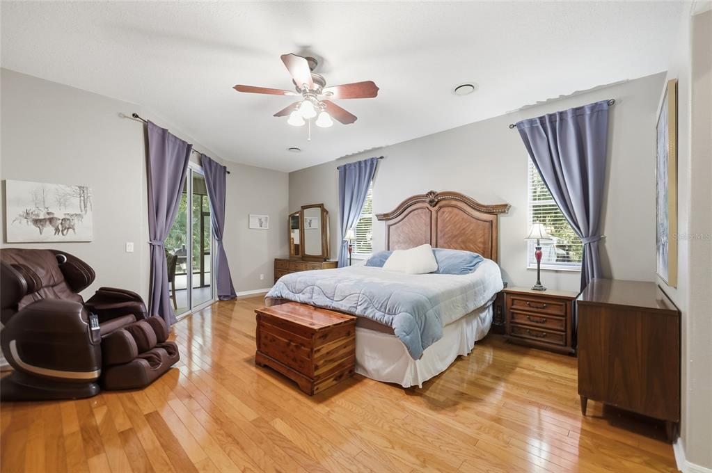 4060 South Kenvera Loop Inverness, FL 34450 - Photo 35 of 50 a bedroom with a bed and wooden floor