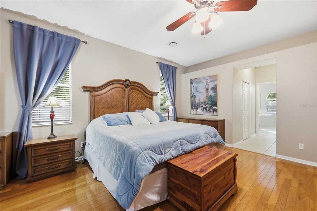 4060 South Kenvera Loop Inverness, FL 34450 - Photo 39 of 50 a bedroom with a bed and wooden floor