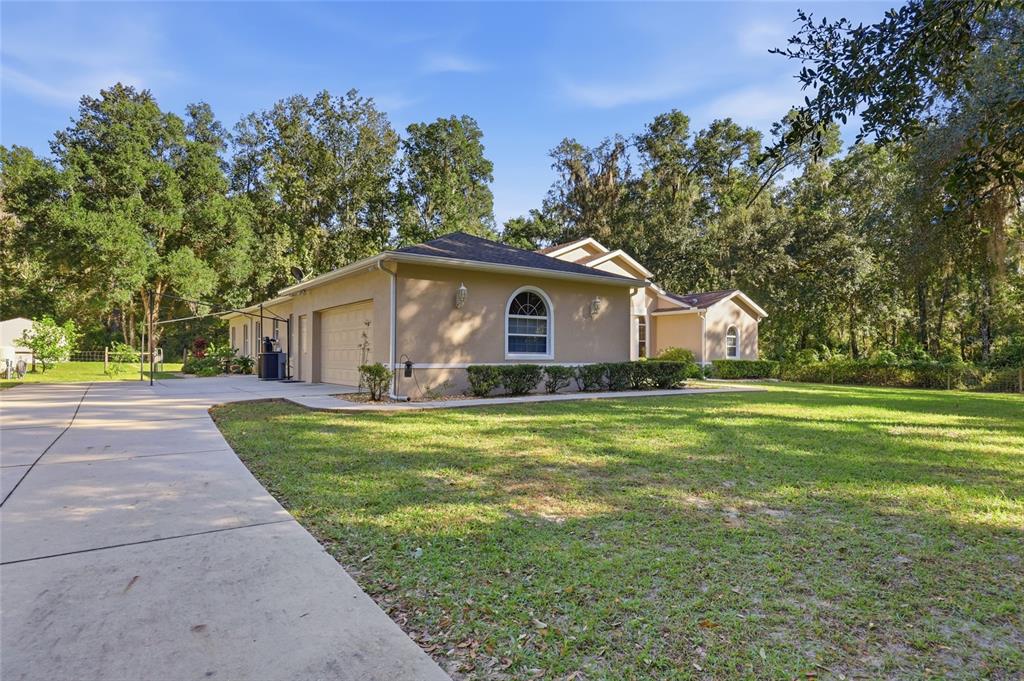 4060 South Kenvera Loop Inverness, FL 34450 - Photo 5 of 50 a front view of house with yard and green space