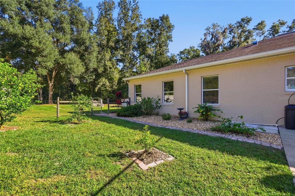 4060 South Kenvera Loop Inverness, FL 34450 - Photo 8 of 50 a view of a house with backyard and a garden
