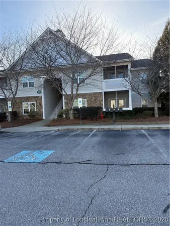 a view of house with a yard