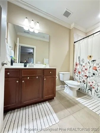 a spacious bathroom with a mirror a sink and a shower