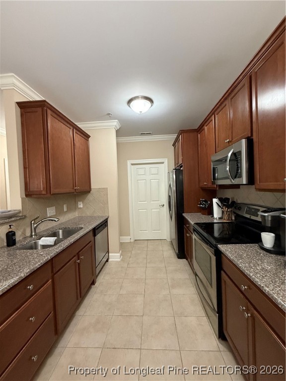 321 Gallery Drive, Unit 203 Spring Lake, NC 28390 - Photo 8 of 25 a kitchen with stainless steel appliances granite countertop a sink stove and refrigerator