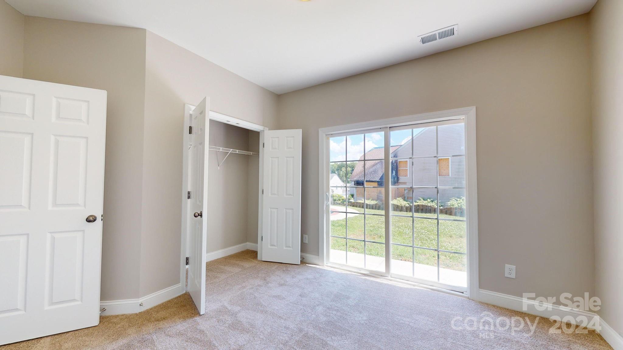 8386 Burgundy Ridge Drive Harrisburg, NC 28075 - Photo 11 of 44 a view of a room with a large window