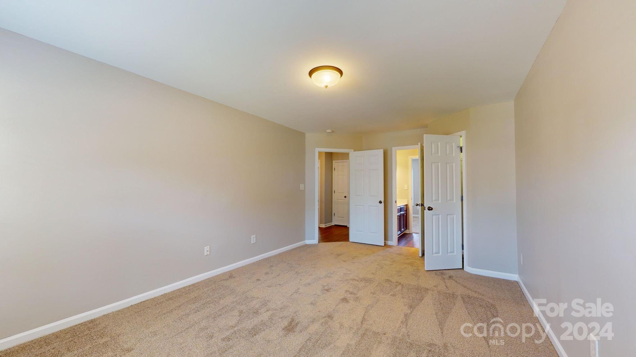 8386 Burgundy Ridge Drive Harrisburg, NC 28075 - Photo 14 of 44 a view of a room with large windows