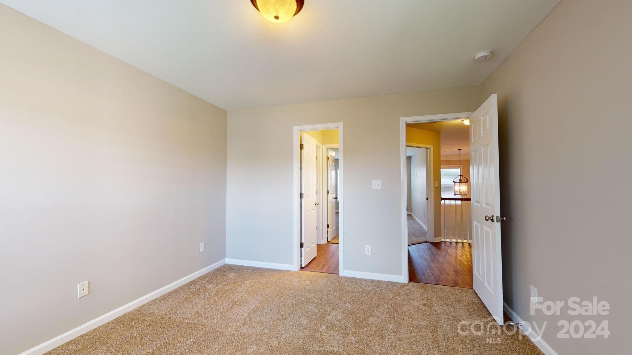 8386 Burgundy Ridge Drive Harrisburg, NC 28075 - Photo 17 of 44 a view of a bedroom with closet area