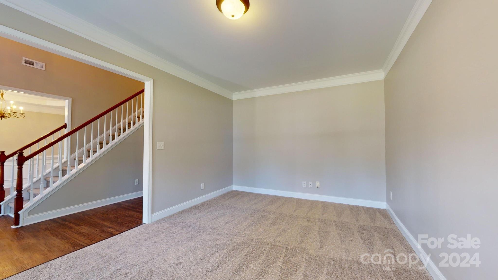 8386 Burgundy Ridge Drive Harrisburg, NC 28075 - Photo 2 of 44 a view of an empty room with stairs