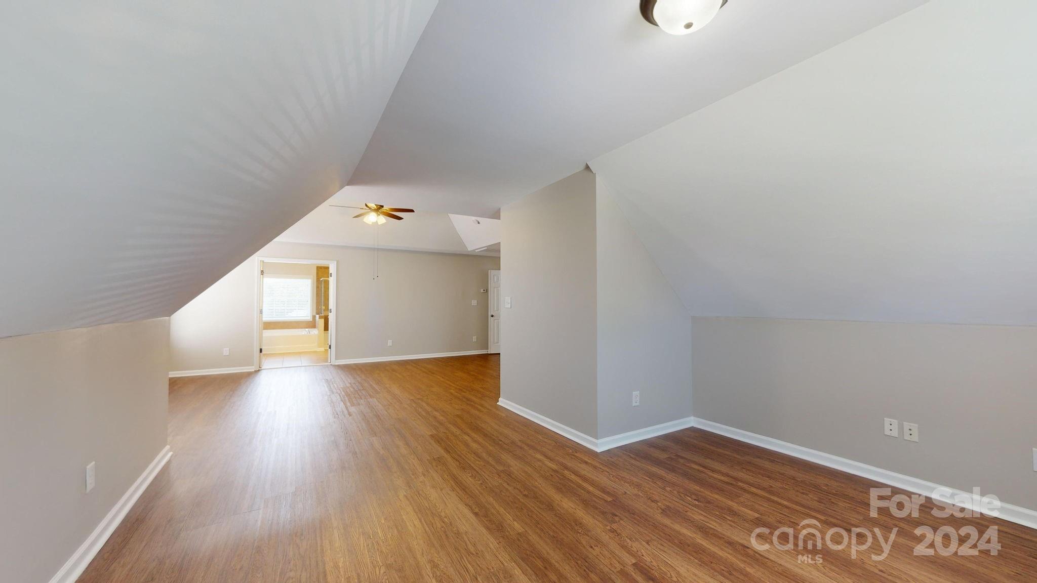 8386 Burgundy Ridge Drive Harrisburg, NC 28075 - Photo 25 of 44 a view of a hallway with wooden floor