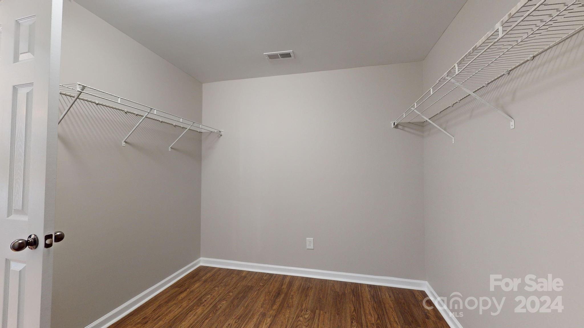 8386 Burgundy Ridge Drive Harrisburg, NC 28075 - Photo 30 of 44 a view of a room with racks on the wall