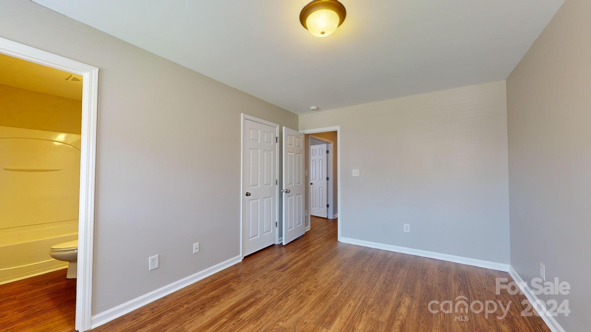 8386 Burgundy Ridge Drive Harrisburg, NC 28075 - Photo 33 of 44 a view of a livingroom with wooden floor