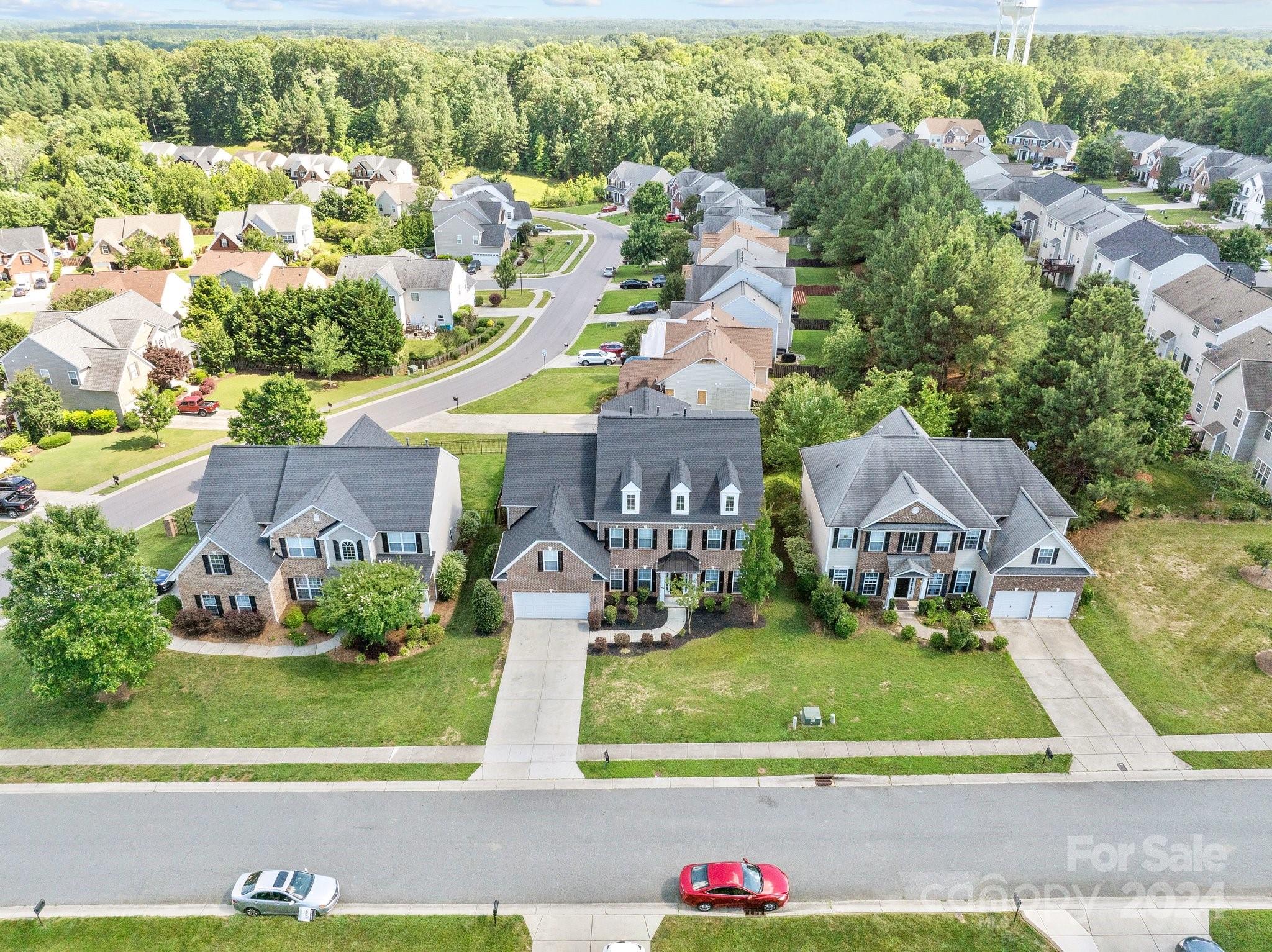8386 Burgundy Ridge Drive Harrisburg, NC 28075 - Photo 38 of 44 an aerial view of a house with a yard