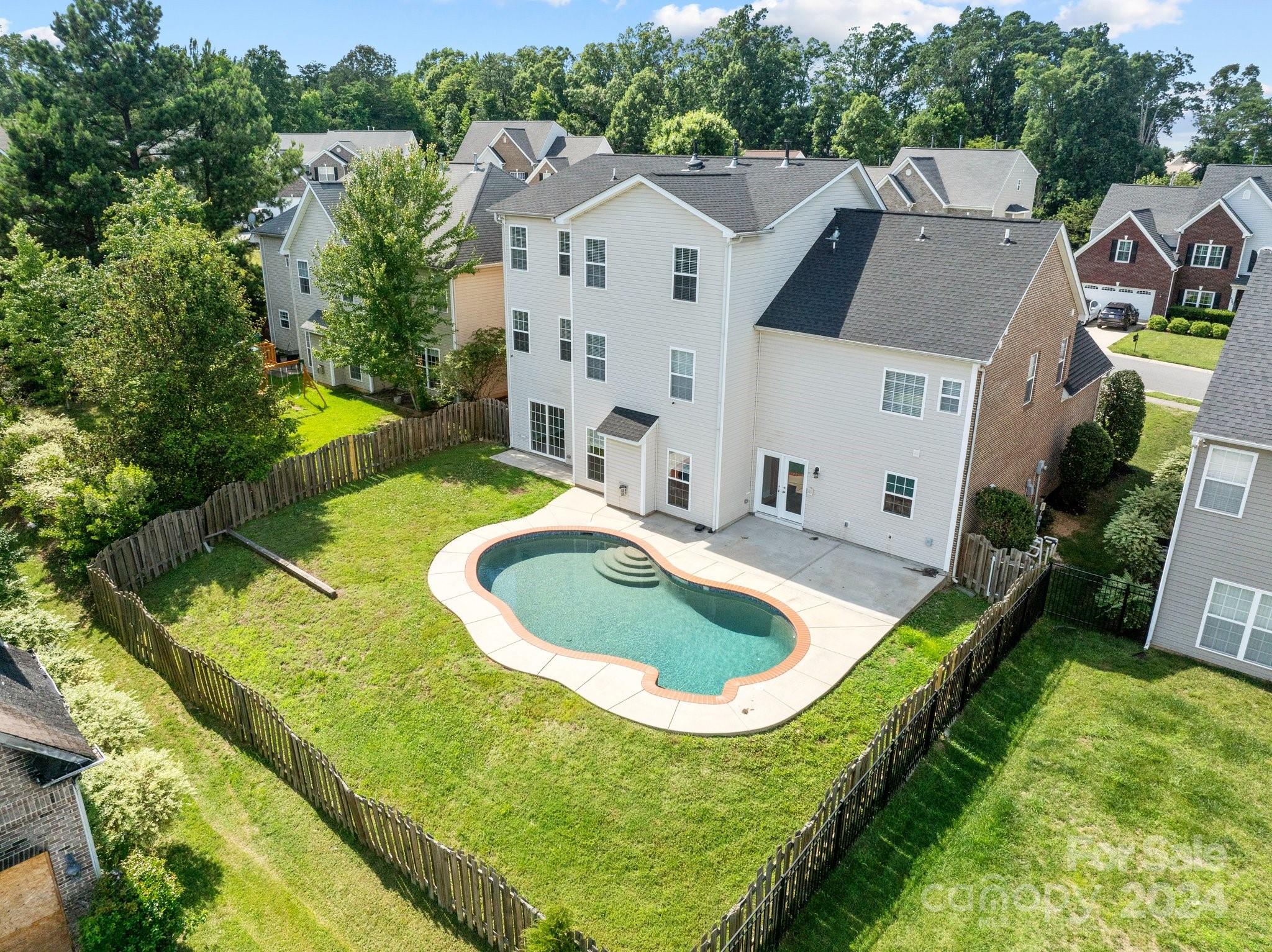 8386 Burgundy Ridge Drive Harrisburg, NC 28075 - Photo 40 of 44 an aerial view of residential house with outdoor space and swimming pool