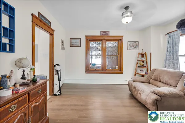 a living room with furniture and a window