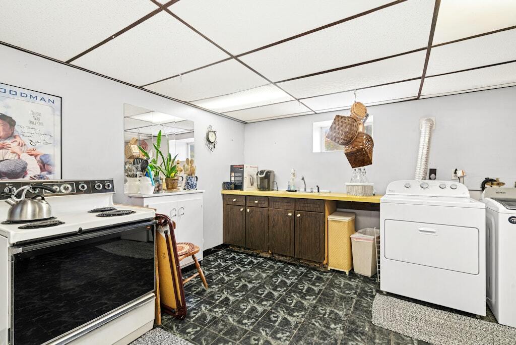 186 Hubbell Avenue Waterbury, CT 06708 - Photo 14 of 20 a kitchen with a sink stove and cabinets