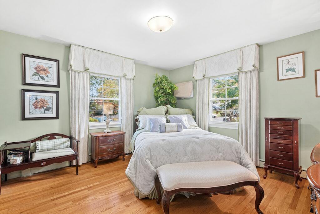 186 Hubbell Avenue Waterbury, CT 06708 - Photo 10 of 20 a bedroom with a bed and wooden floor