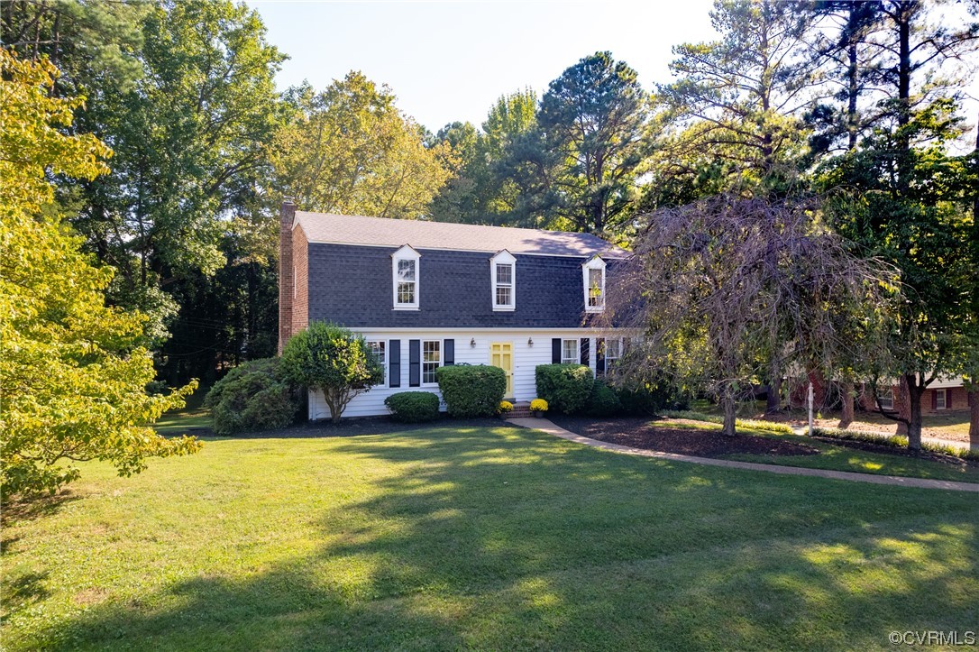 10163 Garfield Road Richmond, VA 23235 - Photo 1 of 44 a view of a house with garden and trees