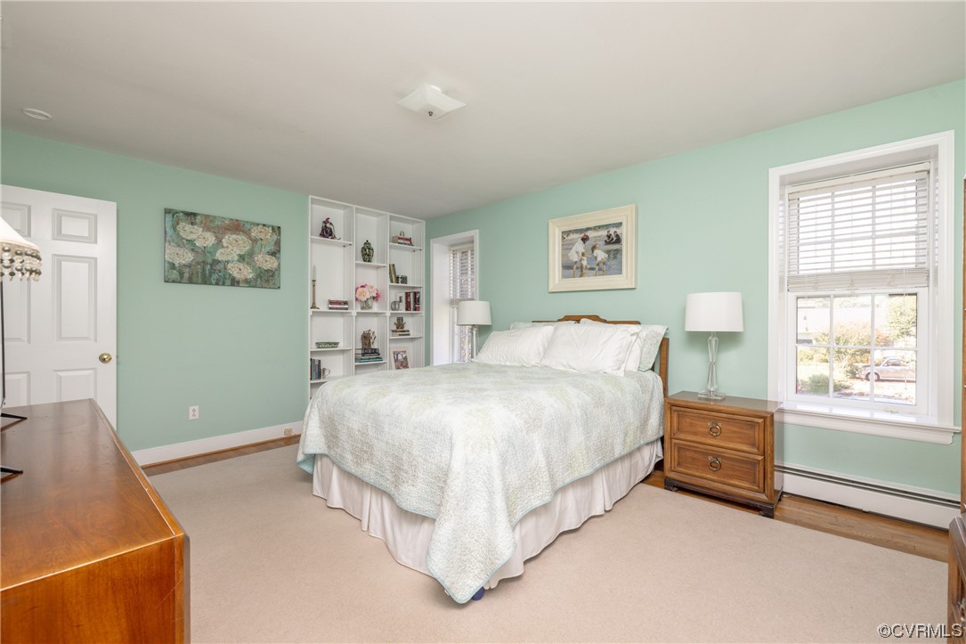 10163 Garfield Road Richmond, VA 23235 - Photo 25 of 44 a spacious bedroom with a bed and a window