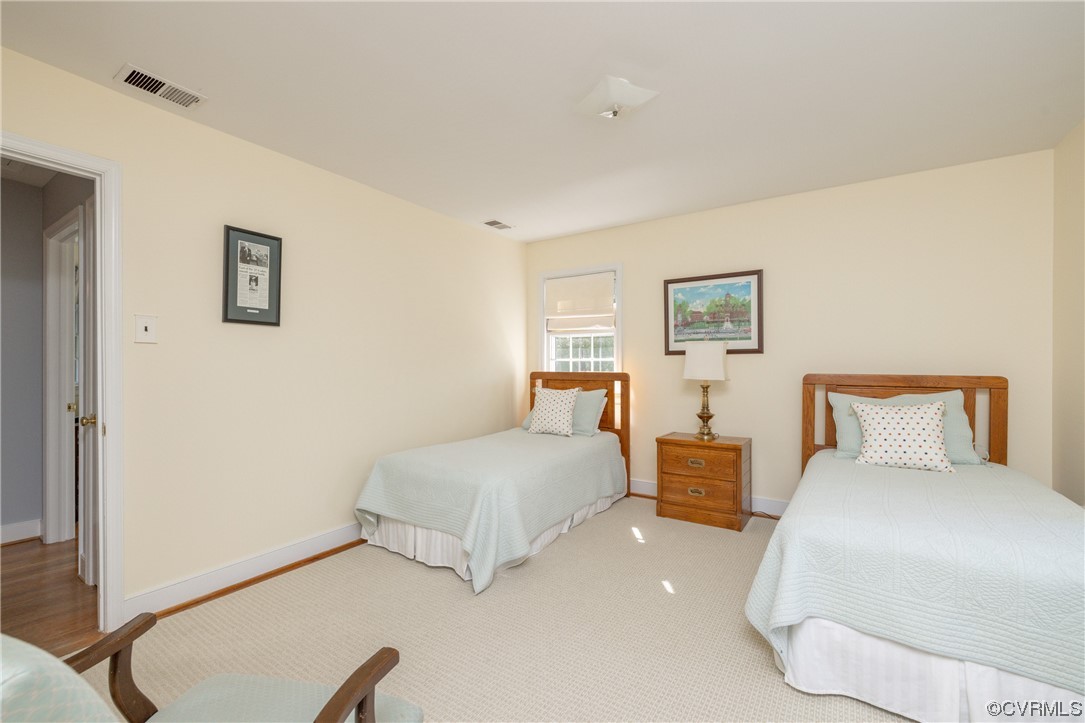 10163 Garfield Road Richmond, VA 23235 - Photo 28 of 44 a bedroom with a bed and a lamp