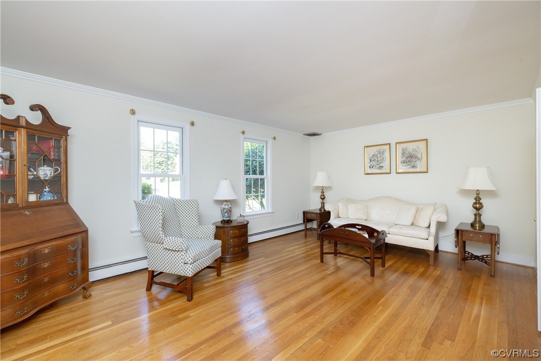 10163 Garfield Road Richmond, VA 23235 - Photo 8 of 44 a living room with furniture and a wooden floor
