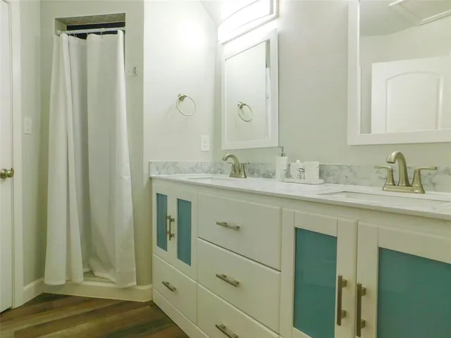 a bathroom with a sink and a mirror