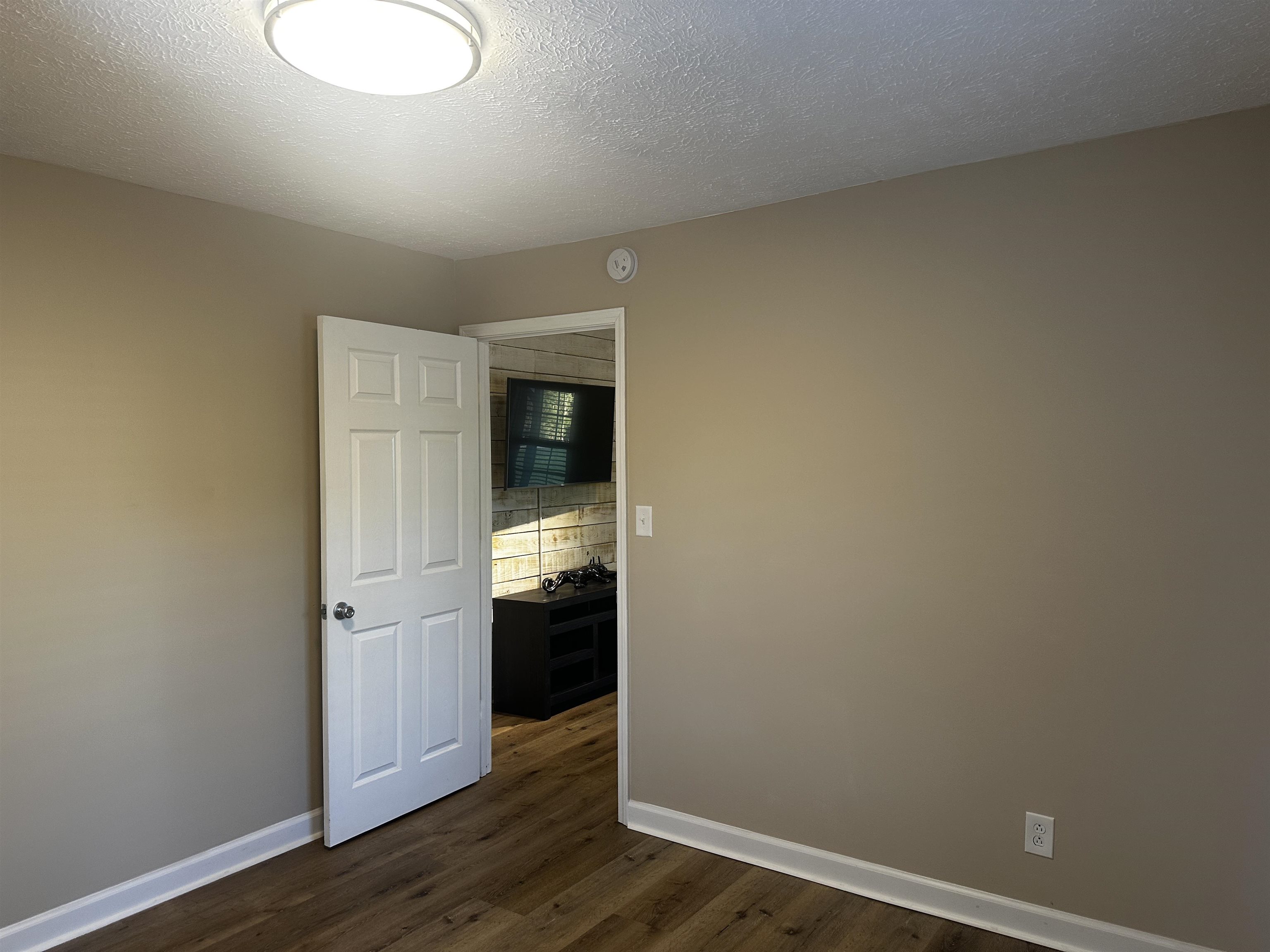 110 Catfish Lane Crump, TN 38327 - Photo 15 of 31 a view of empty room with wooden floor