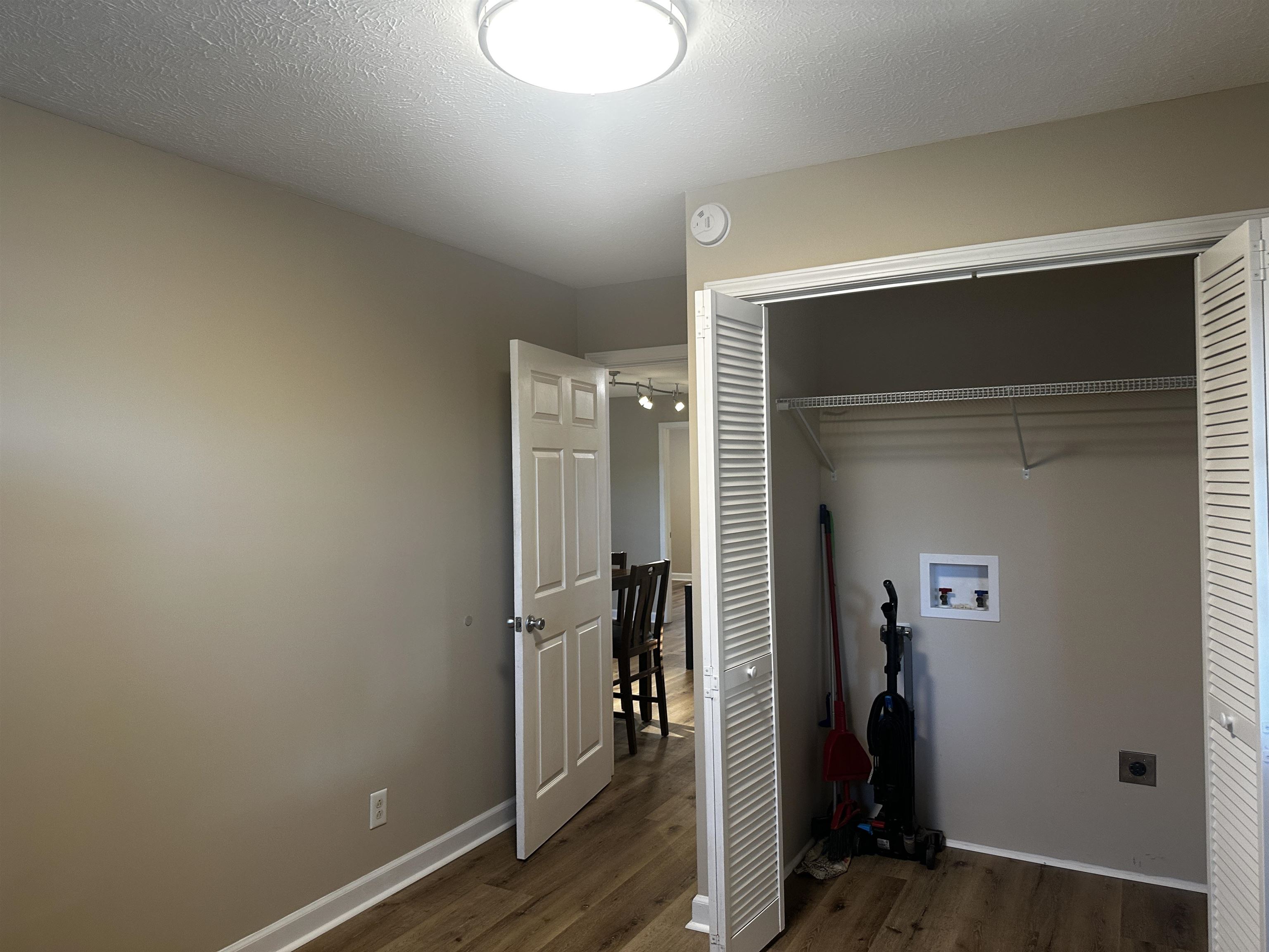 110 Catfish Lane Crump, TN 38327 - Photo 20 of 31 a view of a livingroom with wooden floor and closet