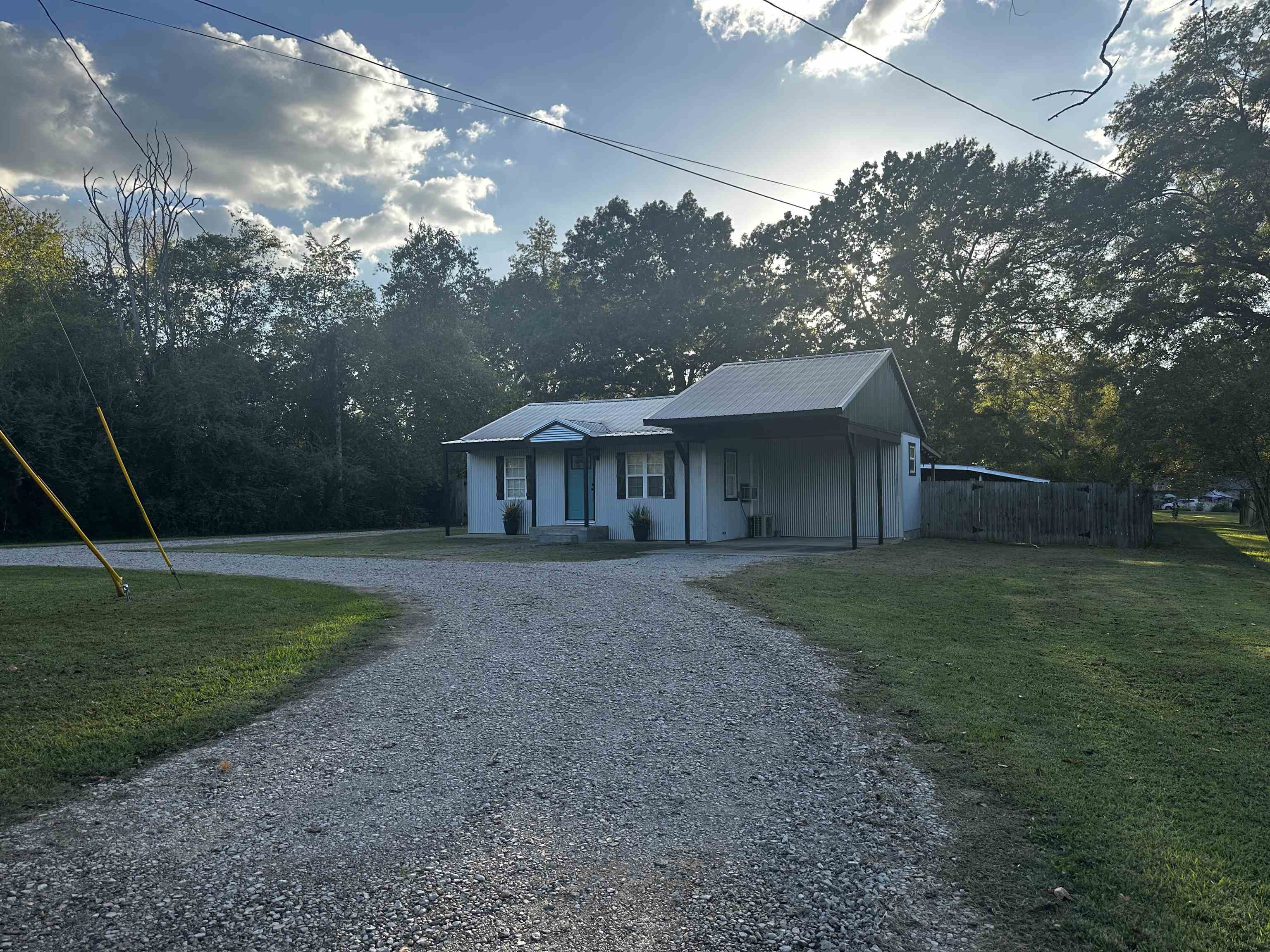 110 Catfish Lane Crump, TN 38327 - Photo 2 of 31 a front view of a house with garden
