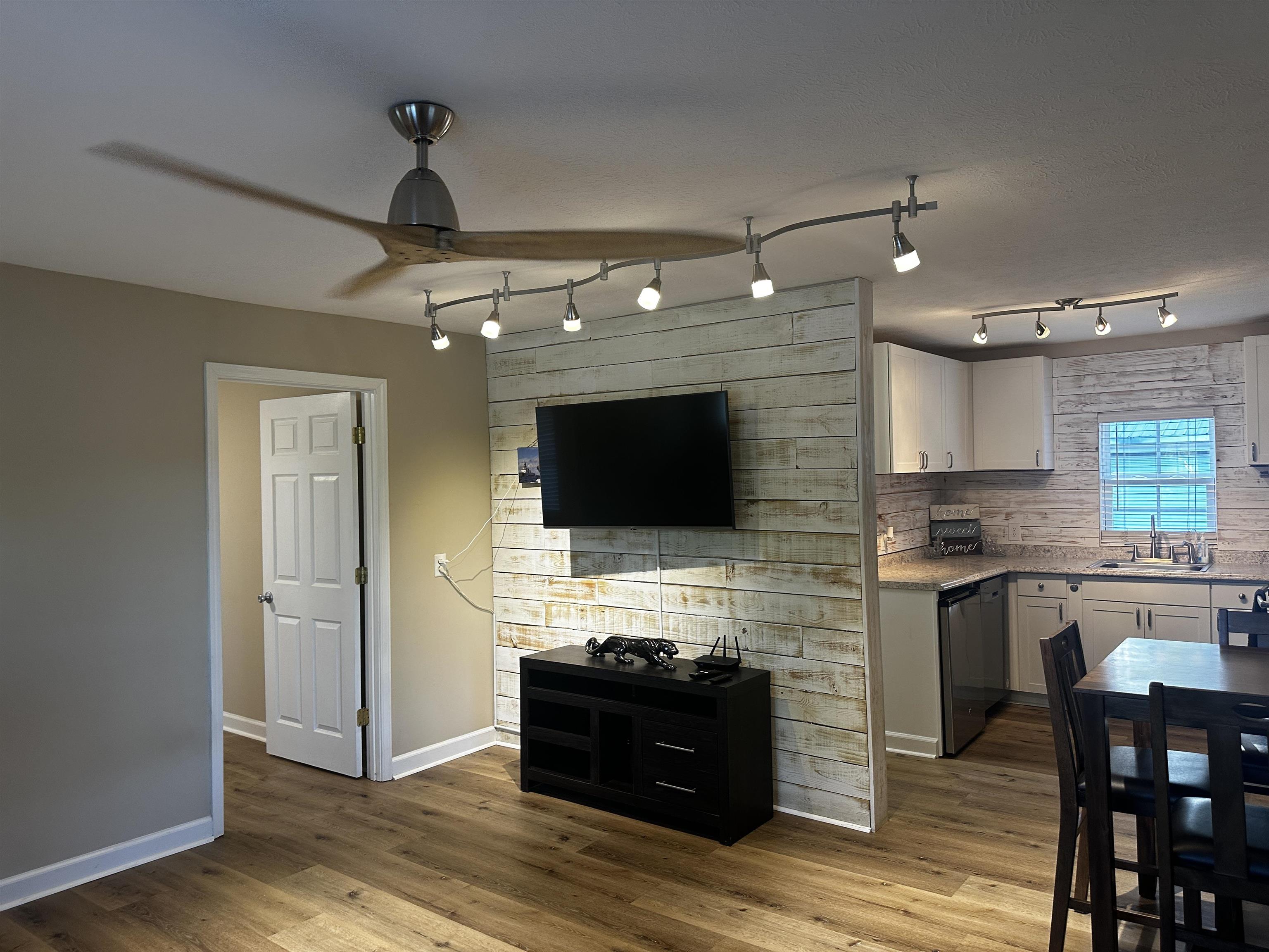 110 Catfish Lane Crump, TN 38327 - Photo 6 of 31 a large kitchen with a stove and a flat screen tv