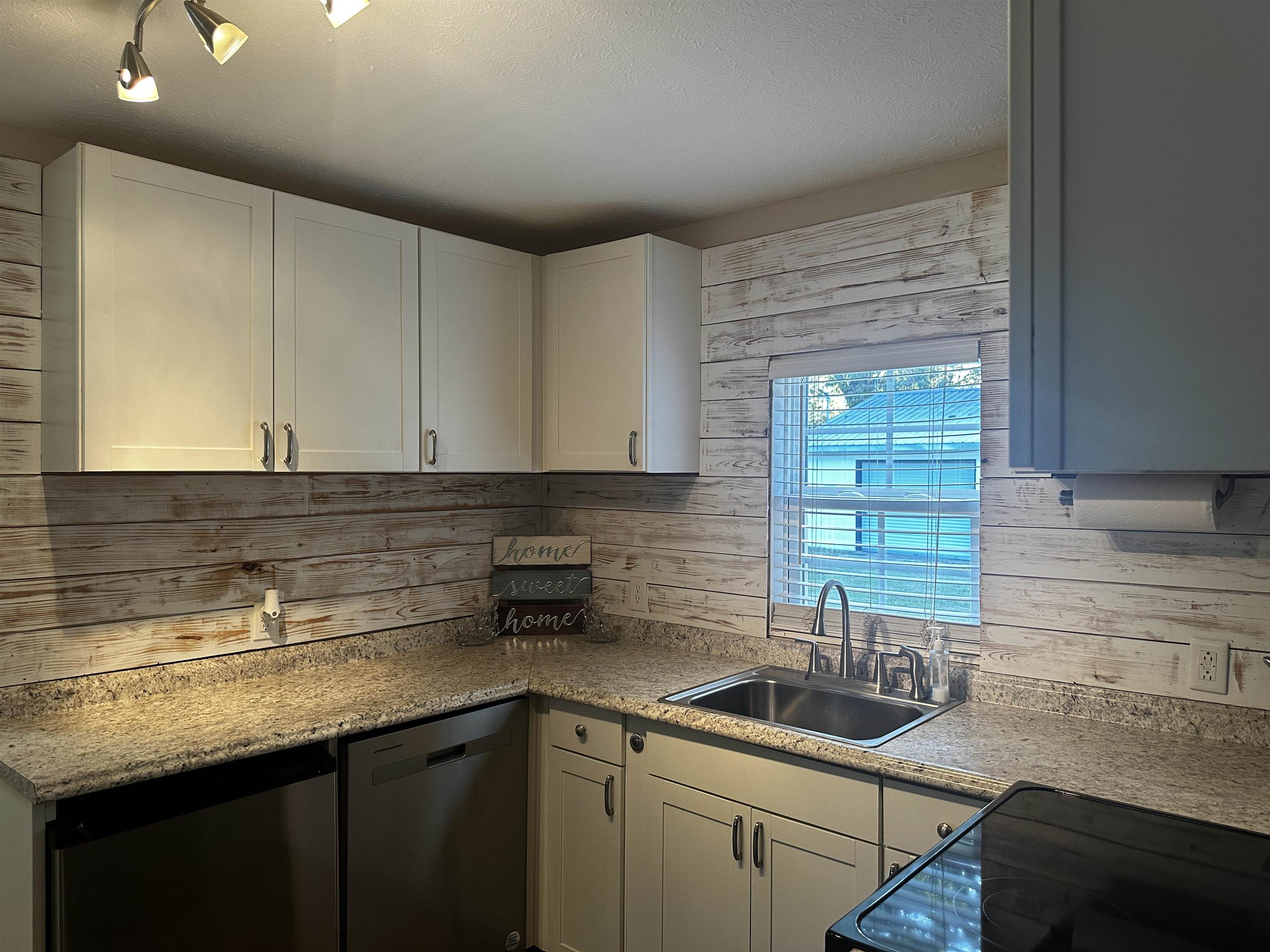 110 Catfish Lane Crump, TN 38327 - Photo 10 of 31 a kitchen with a sink and cabinets