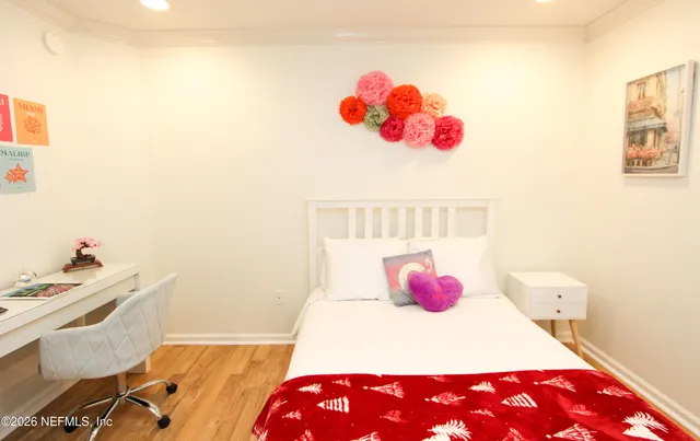 a bedroom with a bed and a couch