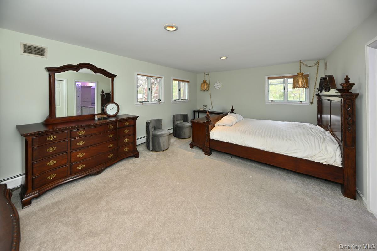19 Sterling Road Spring Valley, NY 10977 - Photo 13 of 20 a bed room with a bed and a dresser