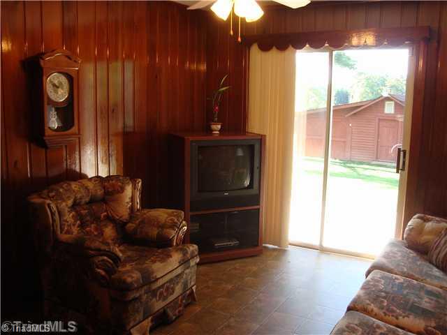 292 Gun Club Road Advance, NC 27006 - Photo 6 of 16 Den/Family/Great Room. currently serving as a cozy den, this room also lends well to a formal dining space