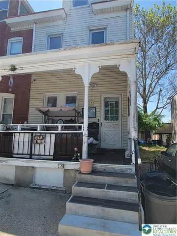 a view of a building with couches