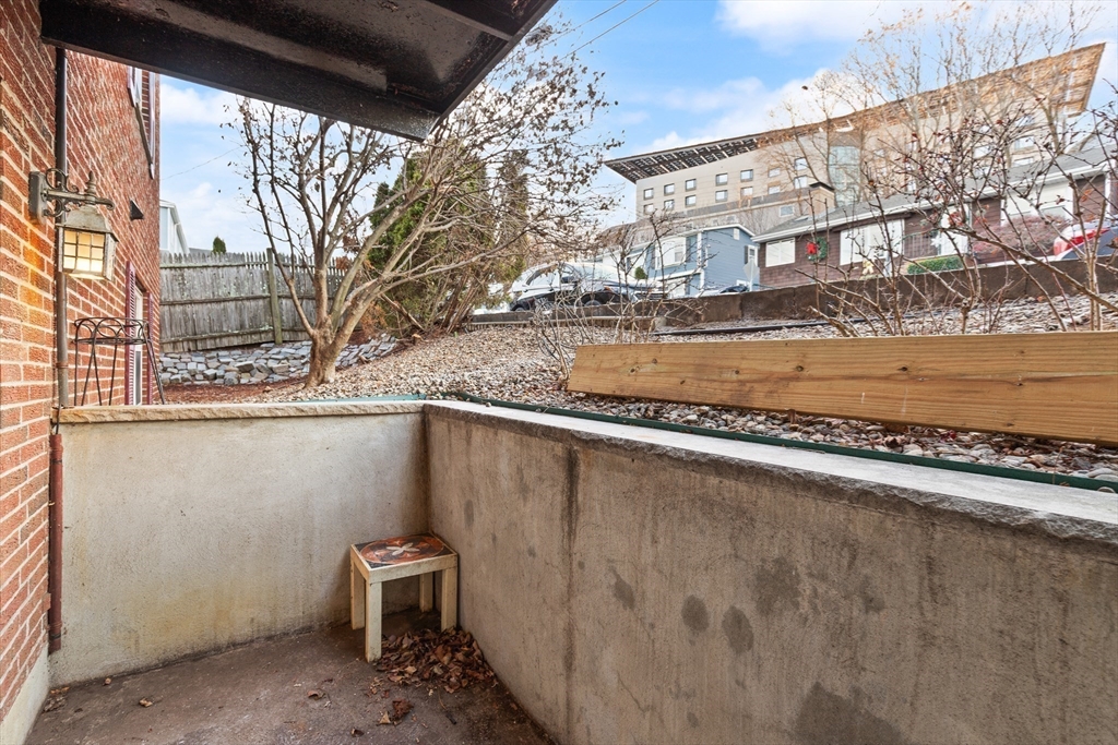 70 Warren Avenue, Unit 18 Chelsea, MA 02150 - Photo 12 of 20 a view of a patio with a yard