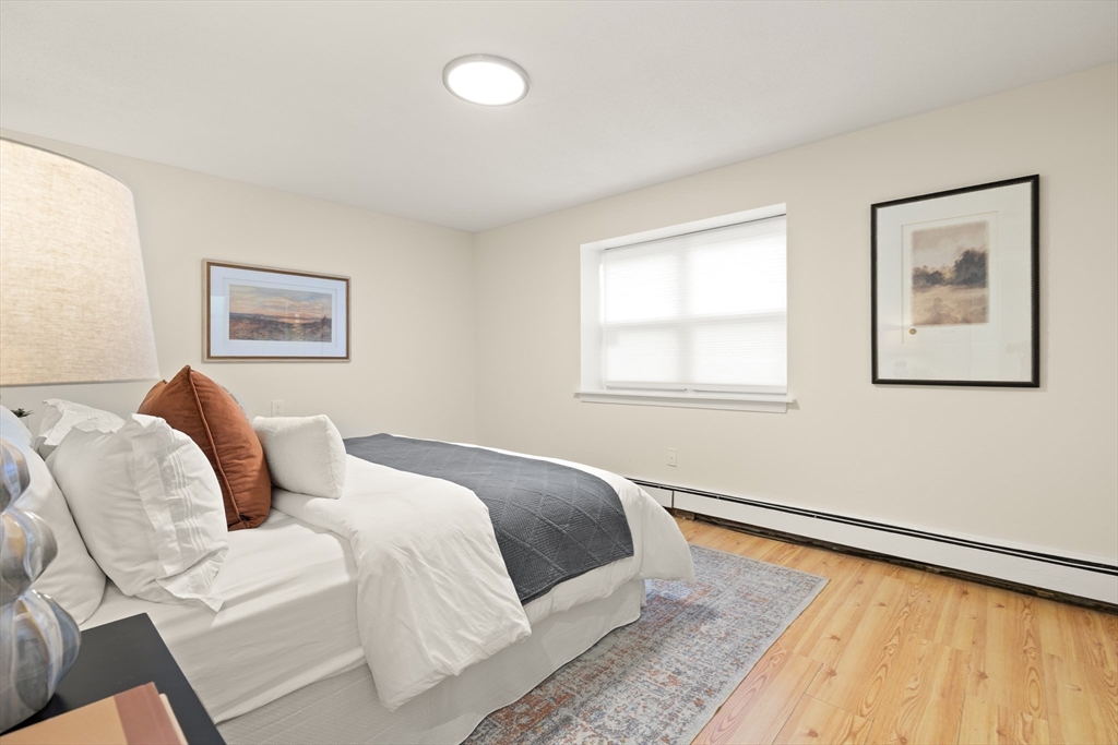 70 Warren Avenue, Unit 18 Chelsea, MA 02150 - Photo 13 of 20 a bed room with a bed and a window