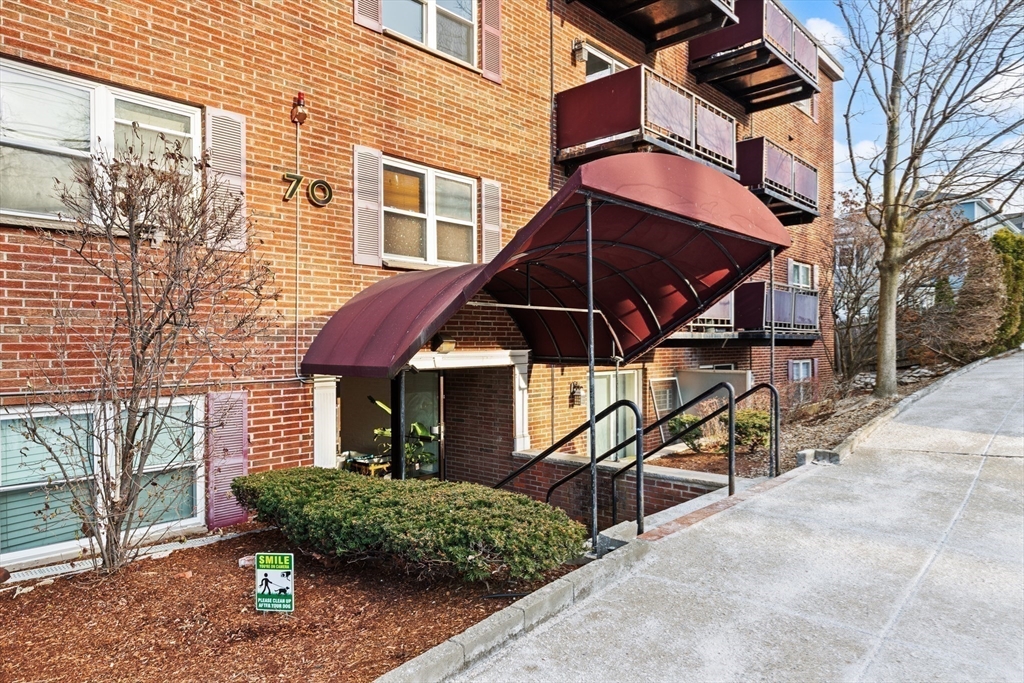 70 Warren Avenue, Unit 18 Chelsea, MA 02150 - Photo 5 of 20 front view of a house with a yard