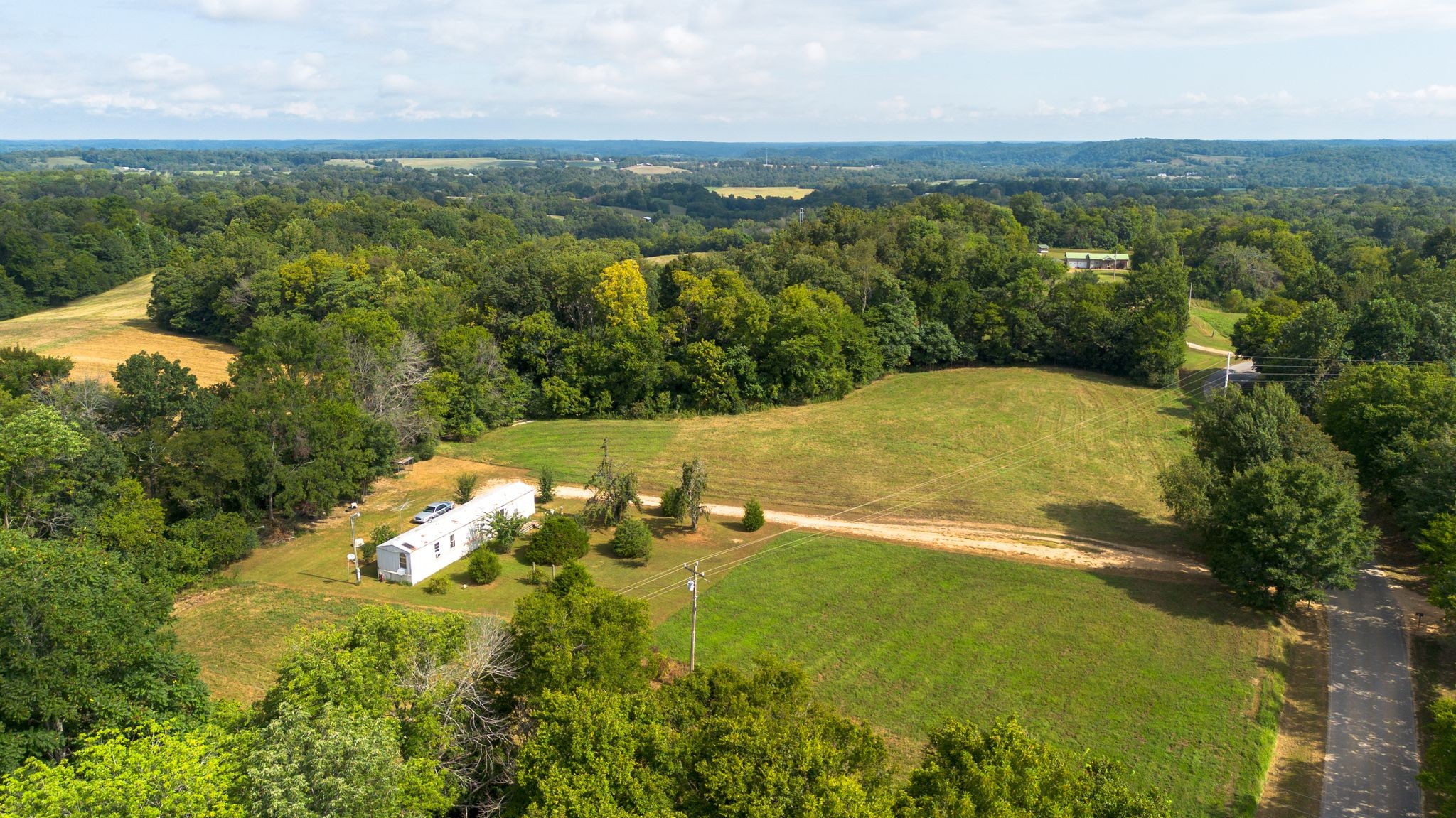 2332 Mobley Ridge Road Duck River, TN 38454 - Photo 2 of 22 an aerial view of a residential houses with outdoor space and trees