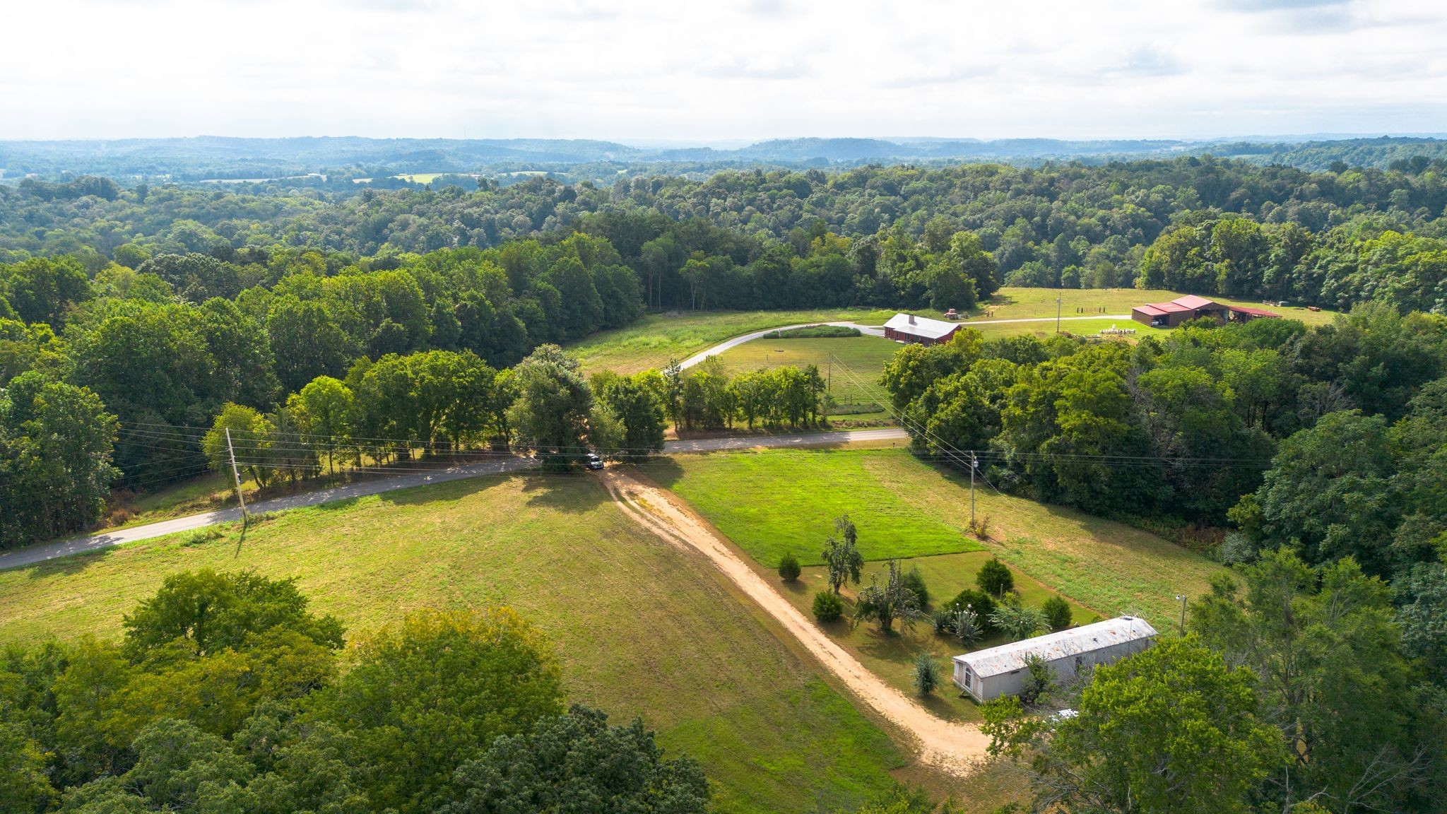 2332 Mobley Ridge Road Duck River, TN 38454 - Photo 5 of 22 a view of a lake with a yard