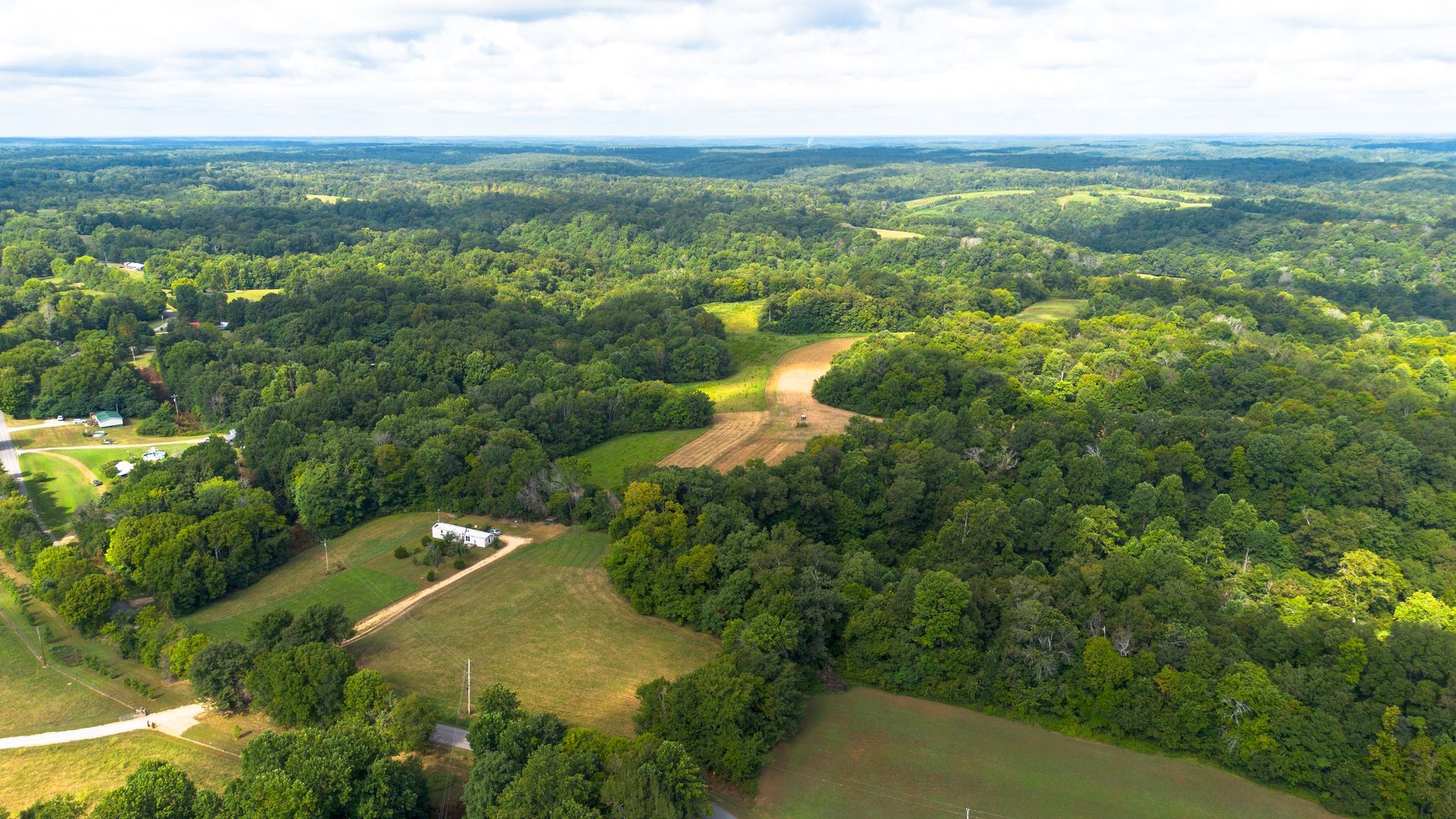2332 Mobley Ridge Road Duck River, TN 38454 - Photo 9 of 22 an aerial view of residential houses with outdoor space and trees